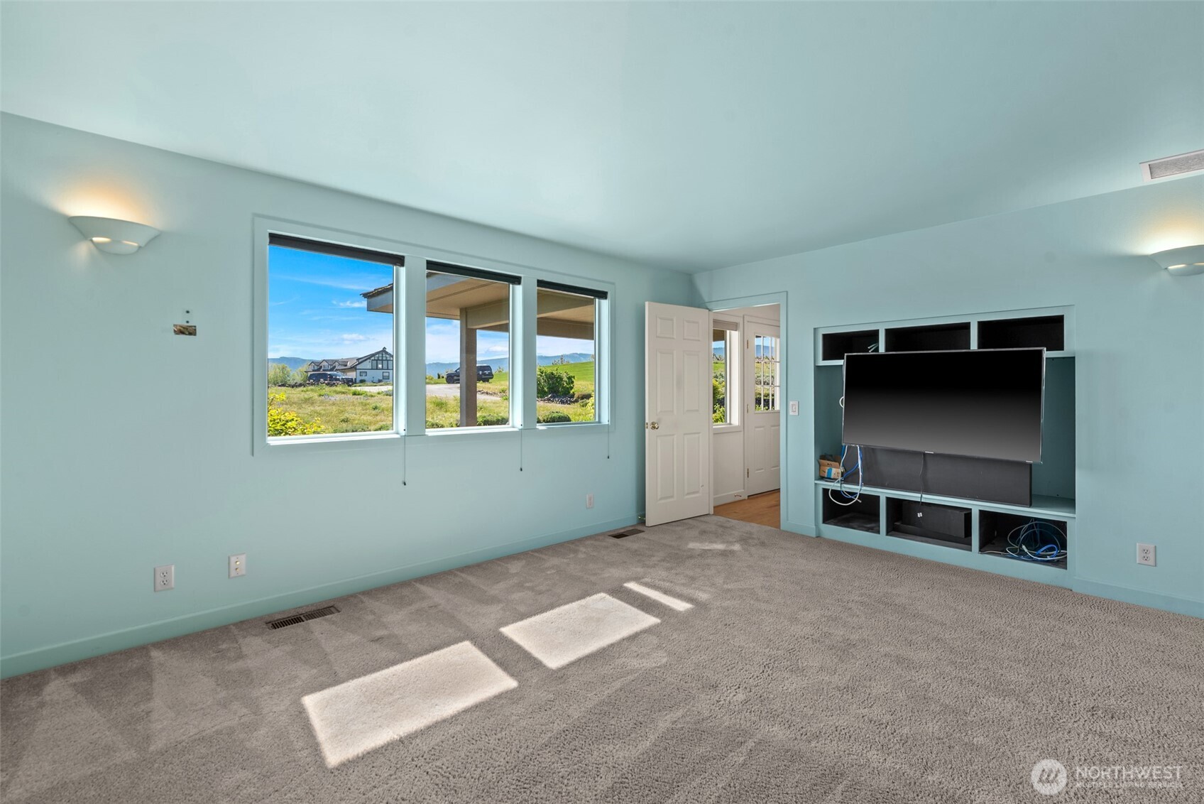 500 Connery Road Wenatchee, WA 98801 - Photo 17 of 39 a view of an empty room with a window and a kitchen