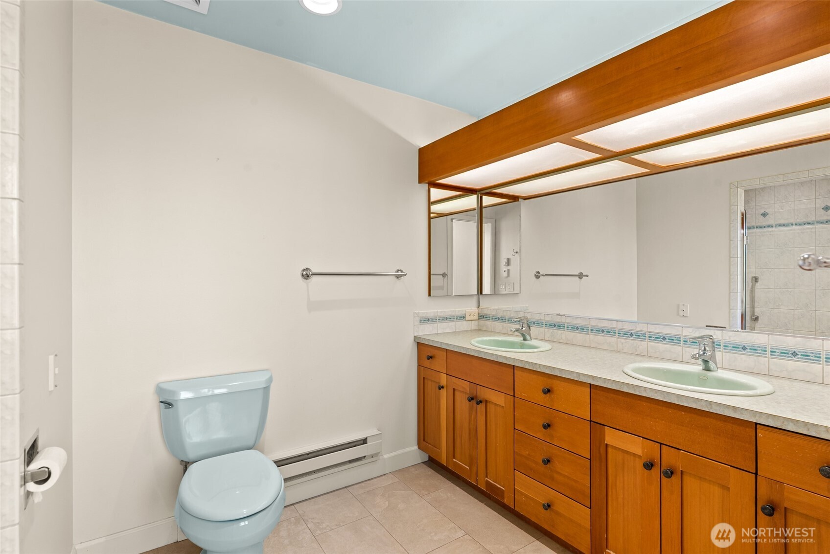 500 Connery Road Wenatchee, WA 98801 - Photo 23 of 39 a bathroom with a granite countertop toilet sink and mirror