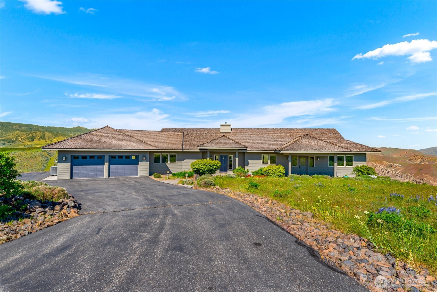 500 Connery Road Wenatchee, WA 98801 - Photo 3 of 39 a front view of a house with a yard and outdoor seating