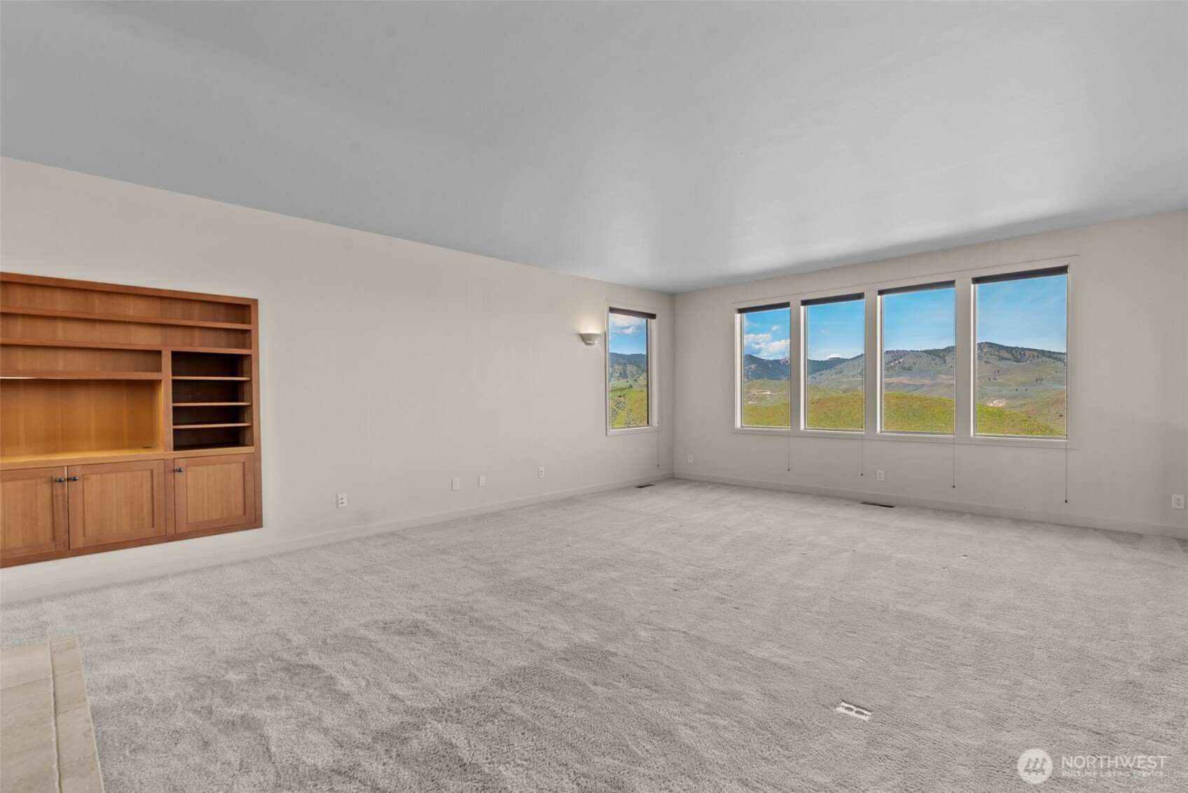 500 Connery Road Wenatchee, WA 98801 - Photo 7 of 39 a view of an empty room with a window and fireplace