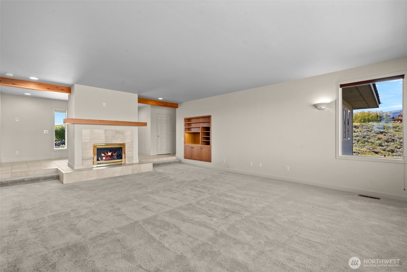 500 Connery Road Wenatchee, WA 98801 - Photo 8 of 39 an empty room with fireplace and window