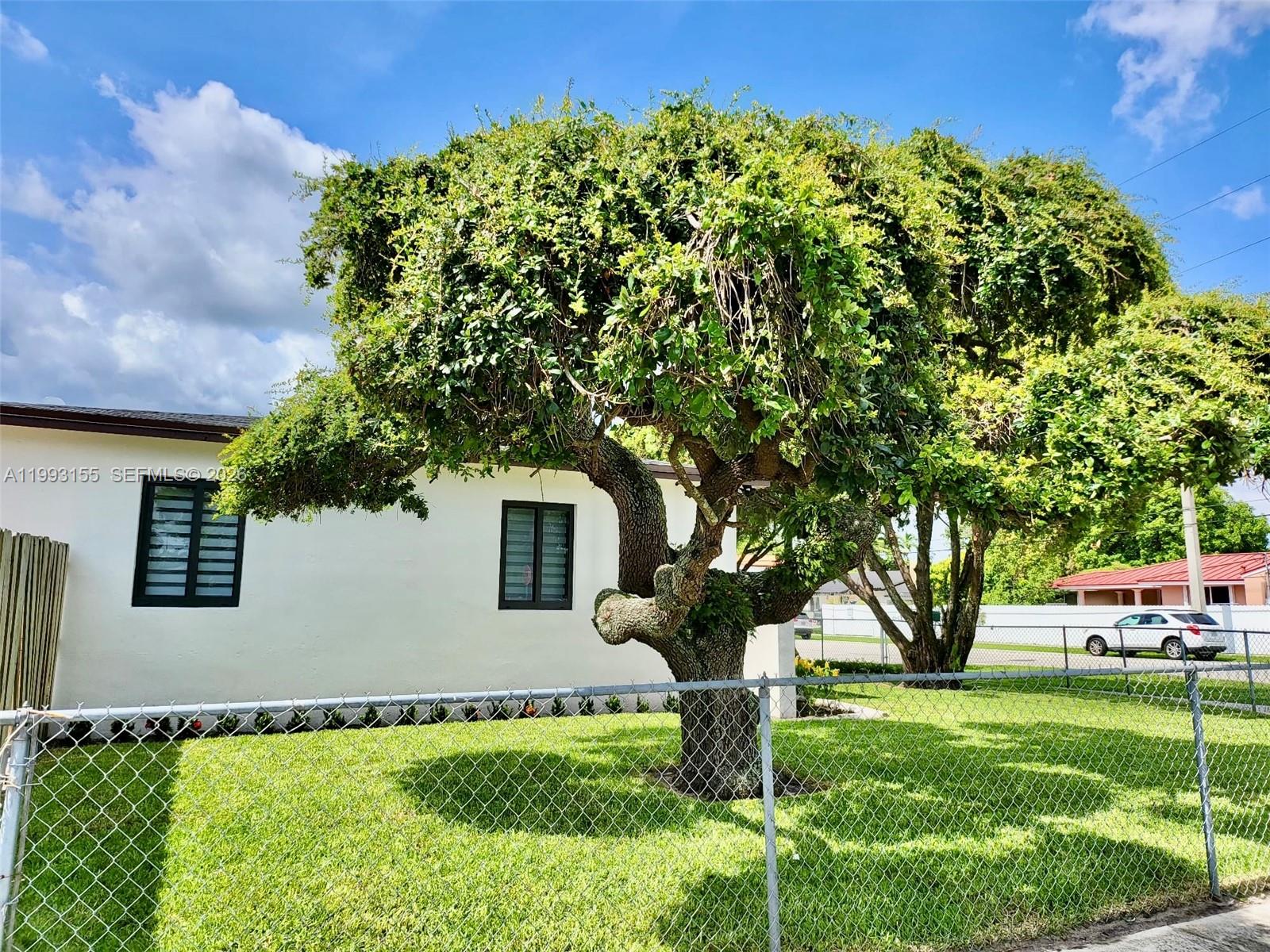 201 Southwest 62nd Avenue Miami, FL 33144 - Photo 4 of 5 a front view of a house with garden