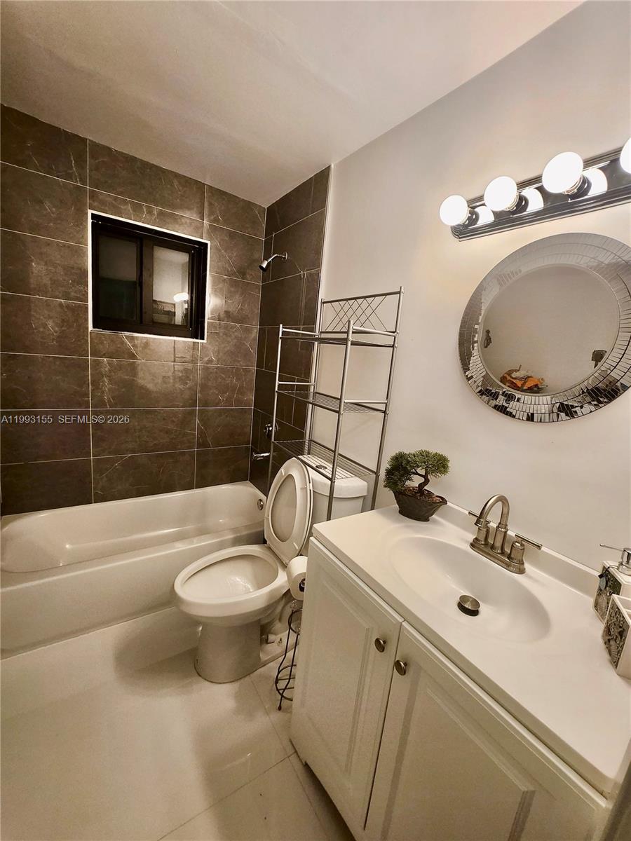201 Southwest 62nd Avenue Miami, FL 33144 - Photo 5 of 5 a bathroom with a sink toilet and shower