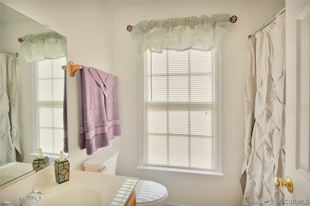 6400 Oldbern Road Chesterfield, VA 23832 - Photo 16 of 19 a bathroom with a granite countertop sink and a mirror