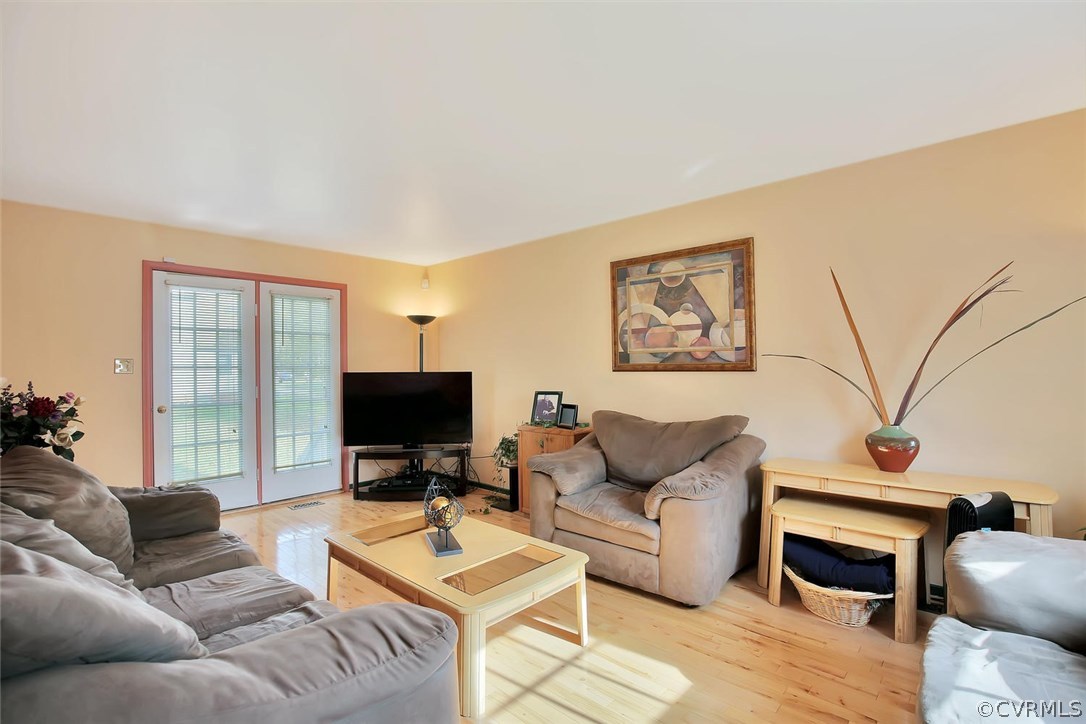 6400 Oldbern Road Chesterfield, VA 23832 - Photo 3 of 19 a living room with furniture and a flat screen tv