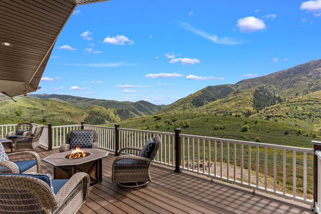 2013 North River View Road Huntsville, UT 84317 - Photo 21 of 53 Wooden terrace featuring a fire pit and a mountain view