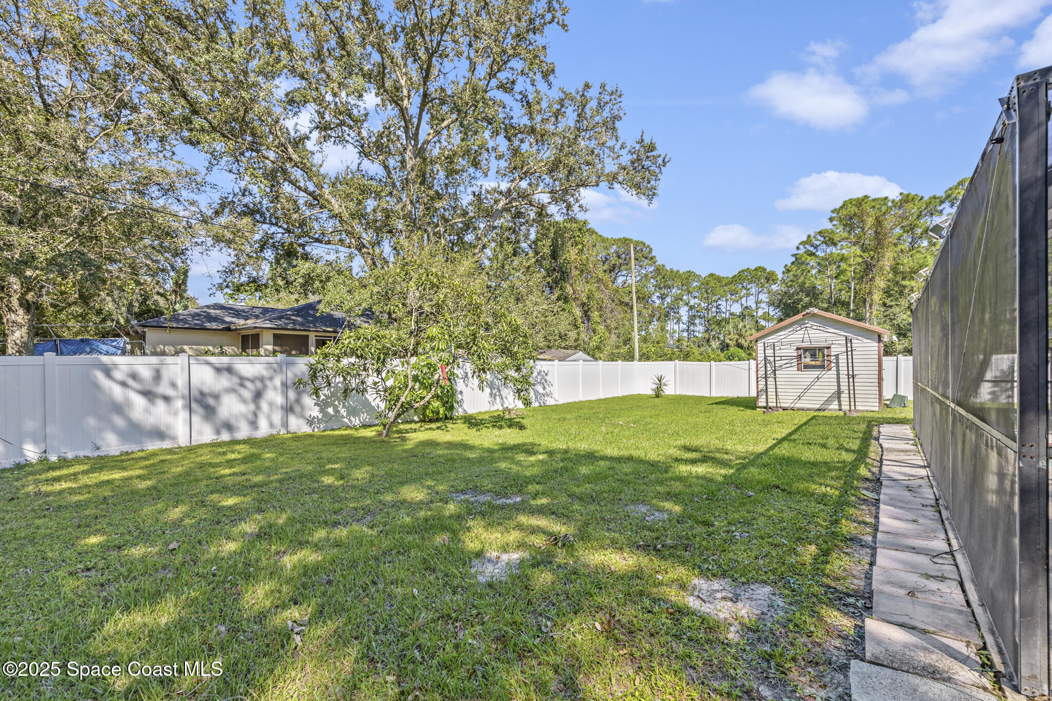 797 Tooley Road Southwest Palm Bay, FL 32908 - Photo 11 of 38 a view of a back yard