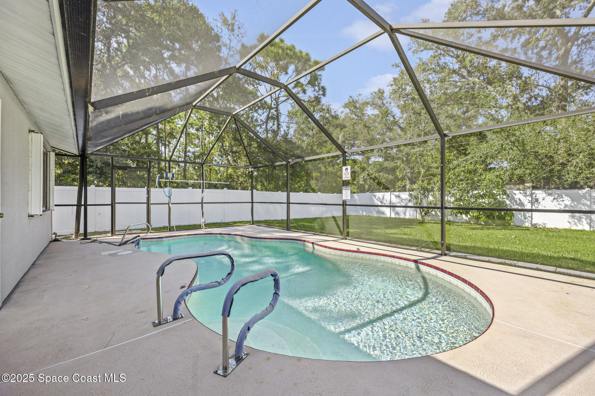 797 Tooley Road Southwest Palm Bay, FL 32908 - Photo 14 of 38 a view of a swimming pool with a porch