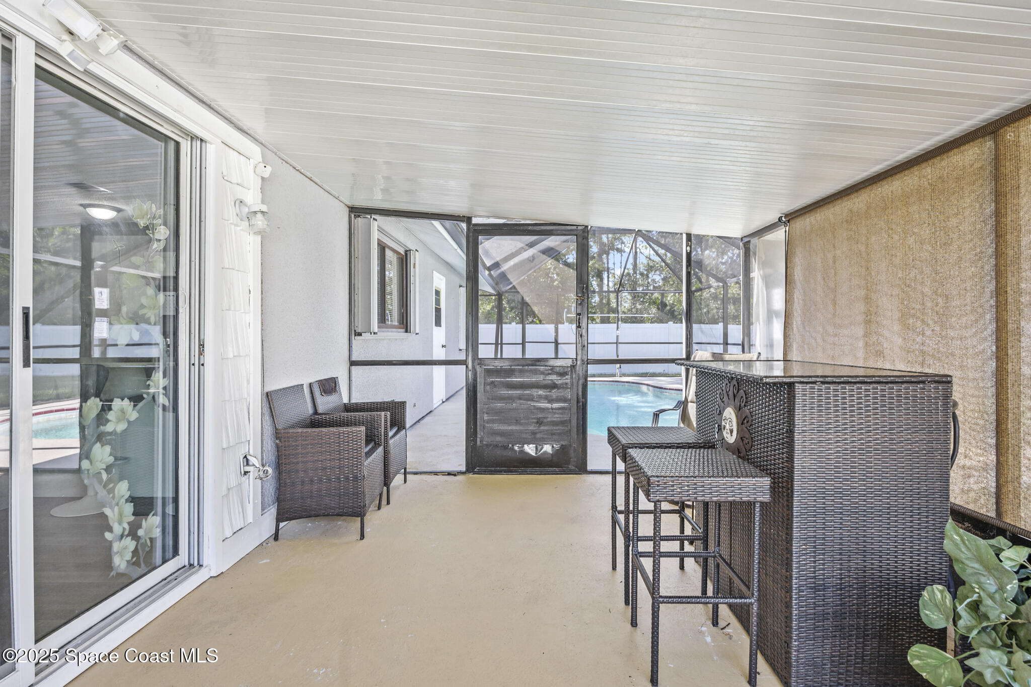797 Tooley Road Southwest Palm Bay, FL 32908 - Photo 16 of 38 a balcony with furniture and a potted plant
