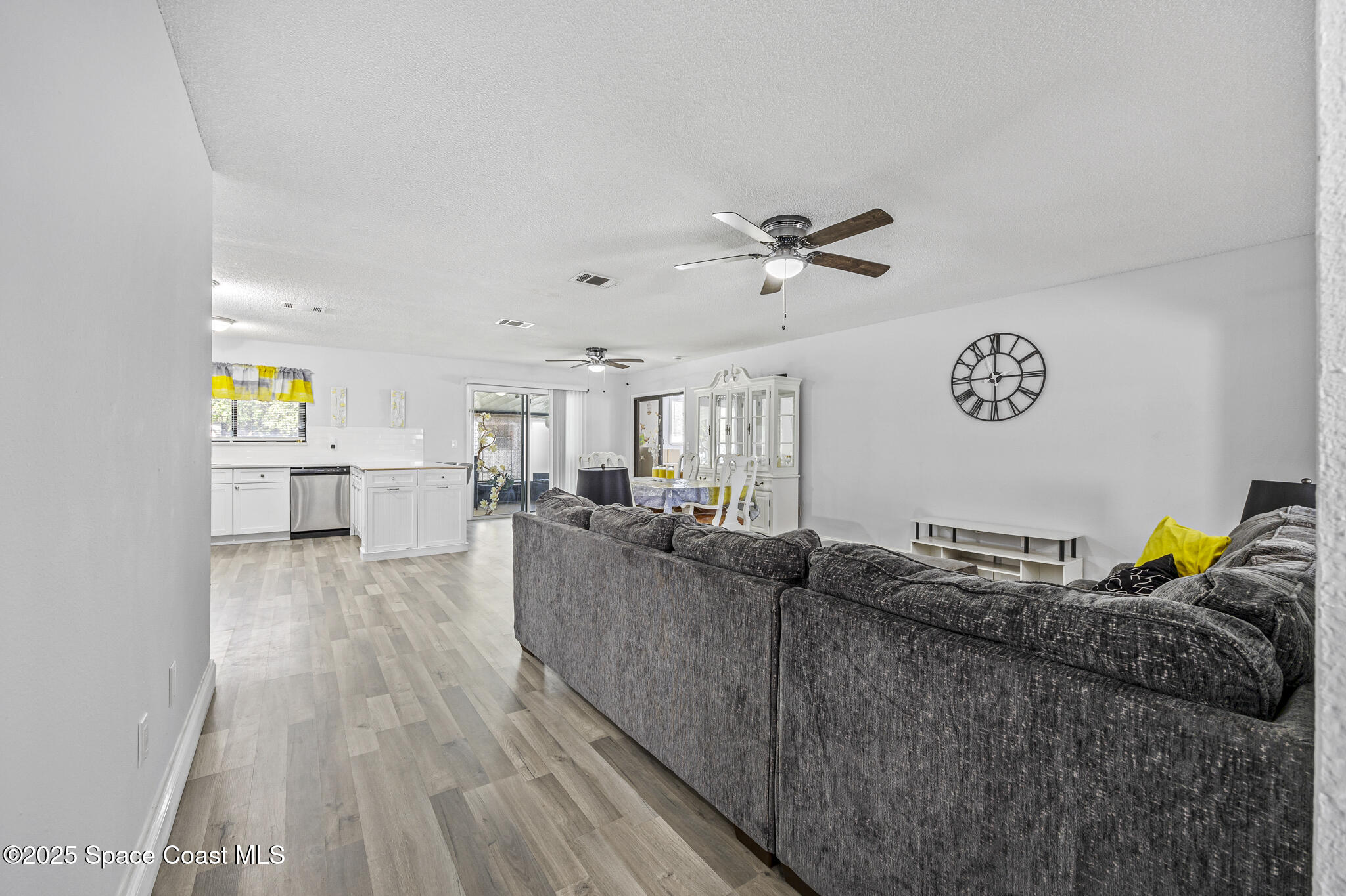 797 Tooley Road Southwest Palm Bay, FL 32908 - Photo 23 of 38 a living room with furniture and wooden floor