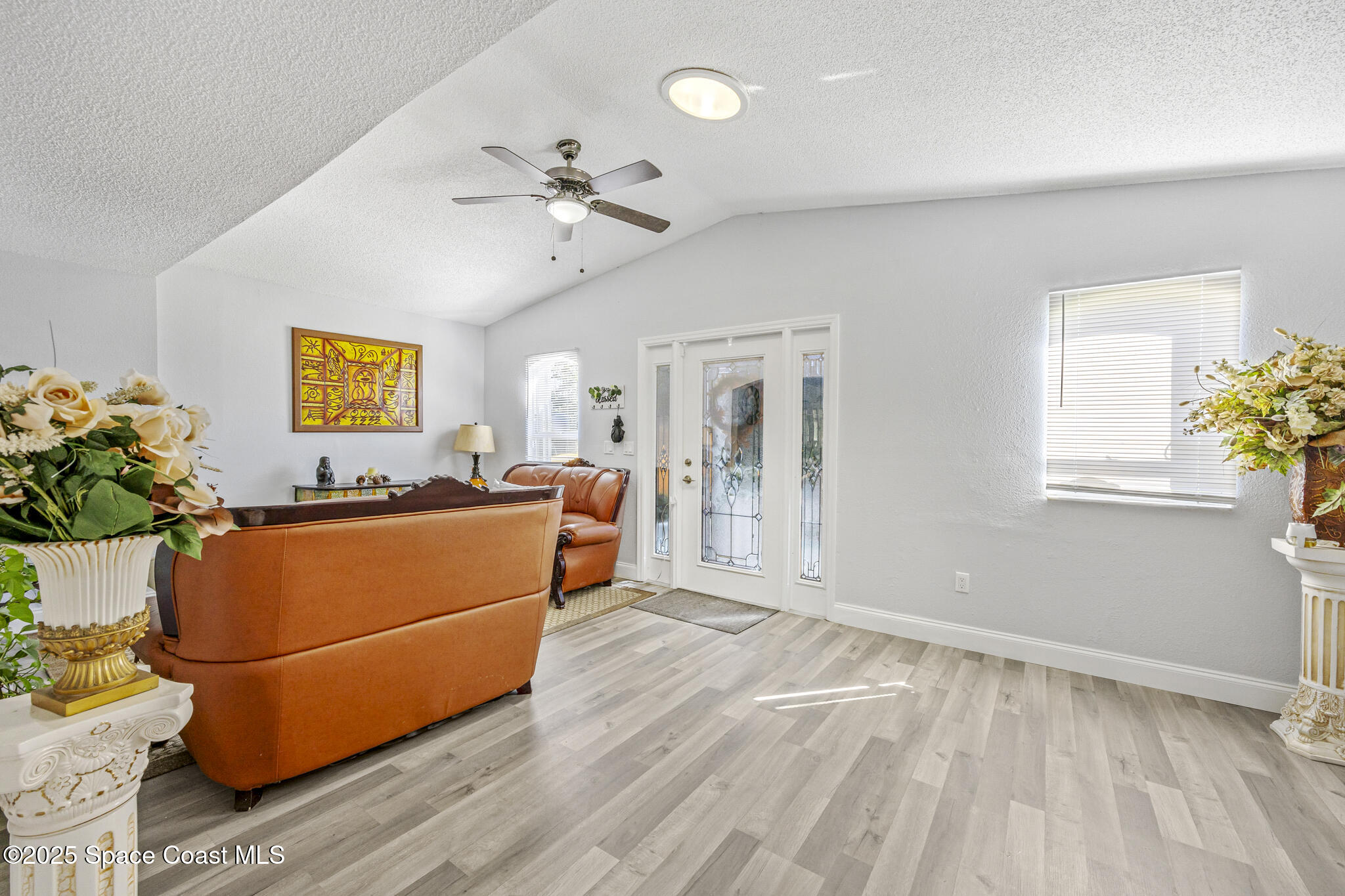 797 Tooley Road Southwest Palm Bay, FL 32908 - Photo 24 of 38 a living room with furniture and a window