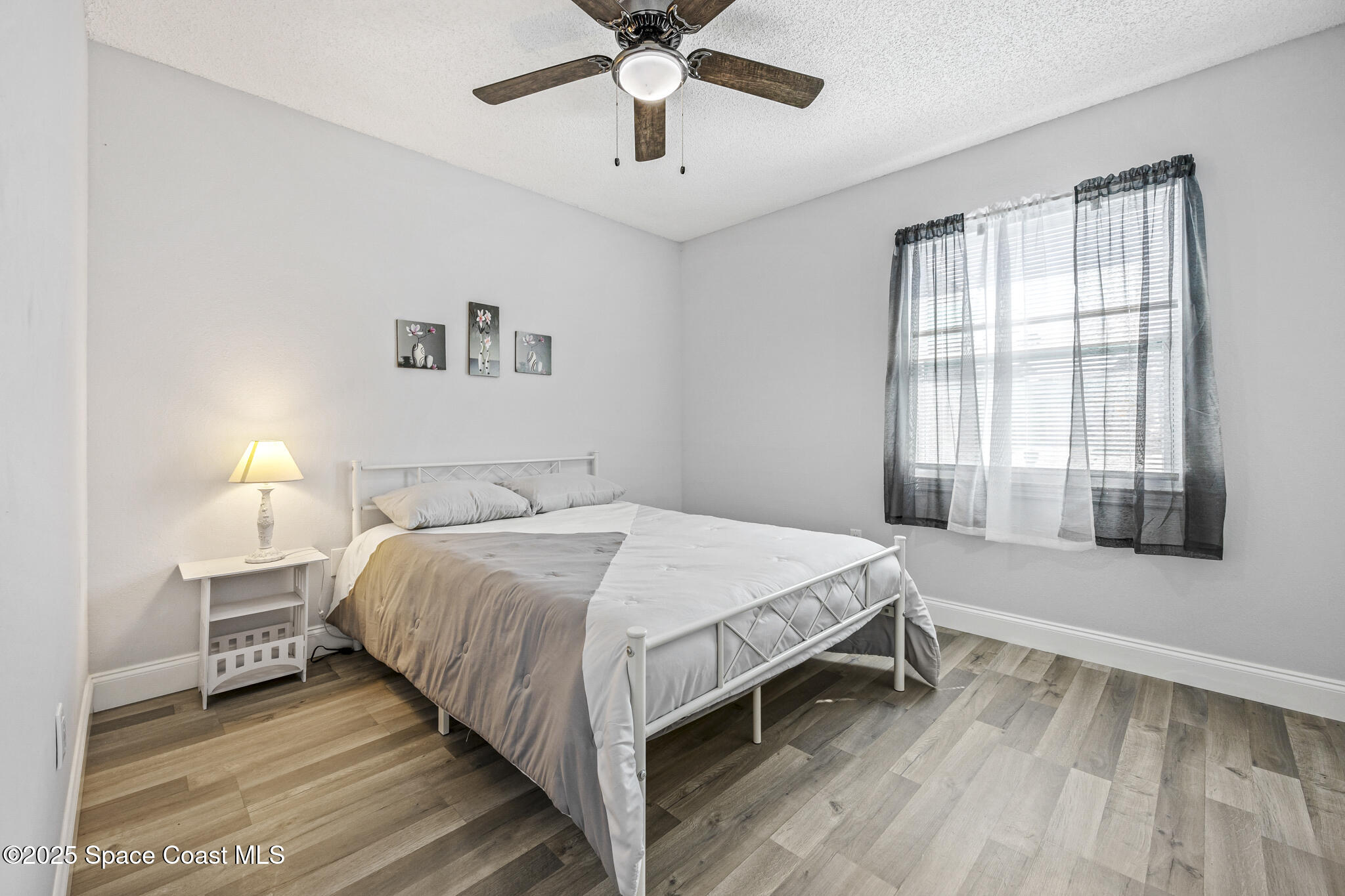 797 Tooley Road Southwest Palm Bay, FL 32908 - Photo 36 of 38 a bedroom with a bed and window