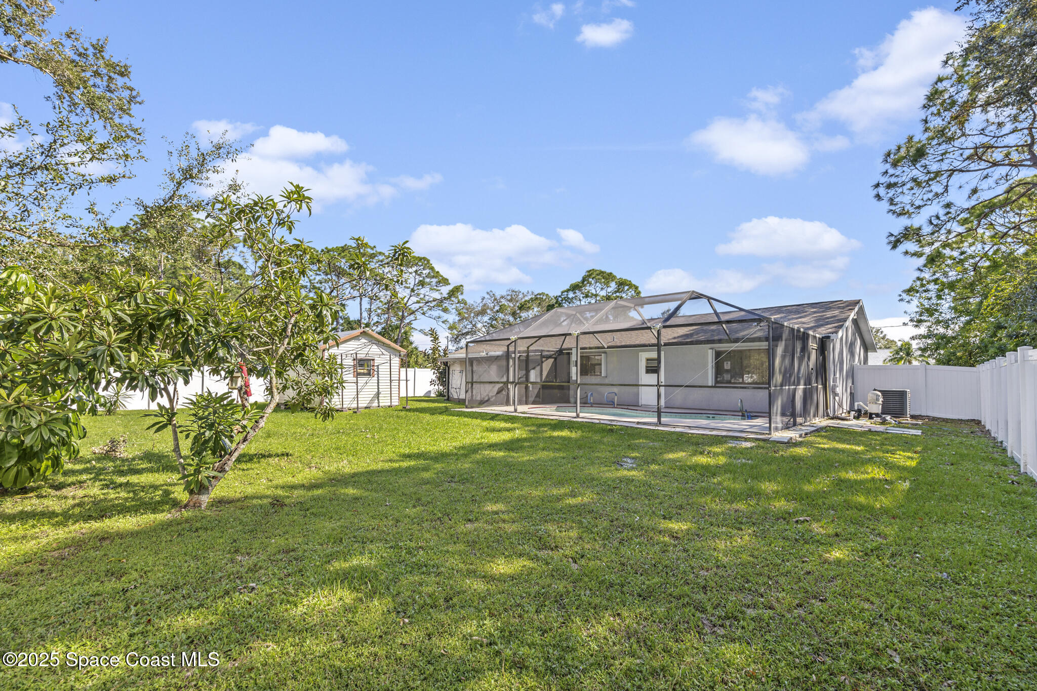 797 Tooley Road Southwest Palm Bay, FL 32908 - Photo 10 of 38 a view of a house with a big yard