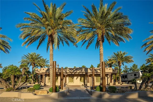 a view of a patio with swimming pool table and chairs