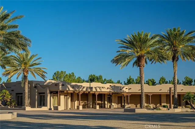 a view of a terrace with a table and chairs