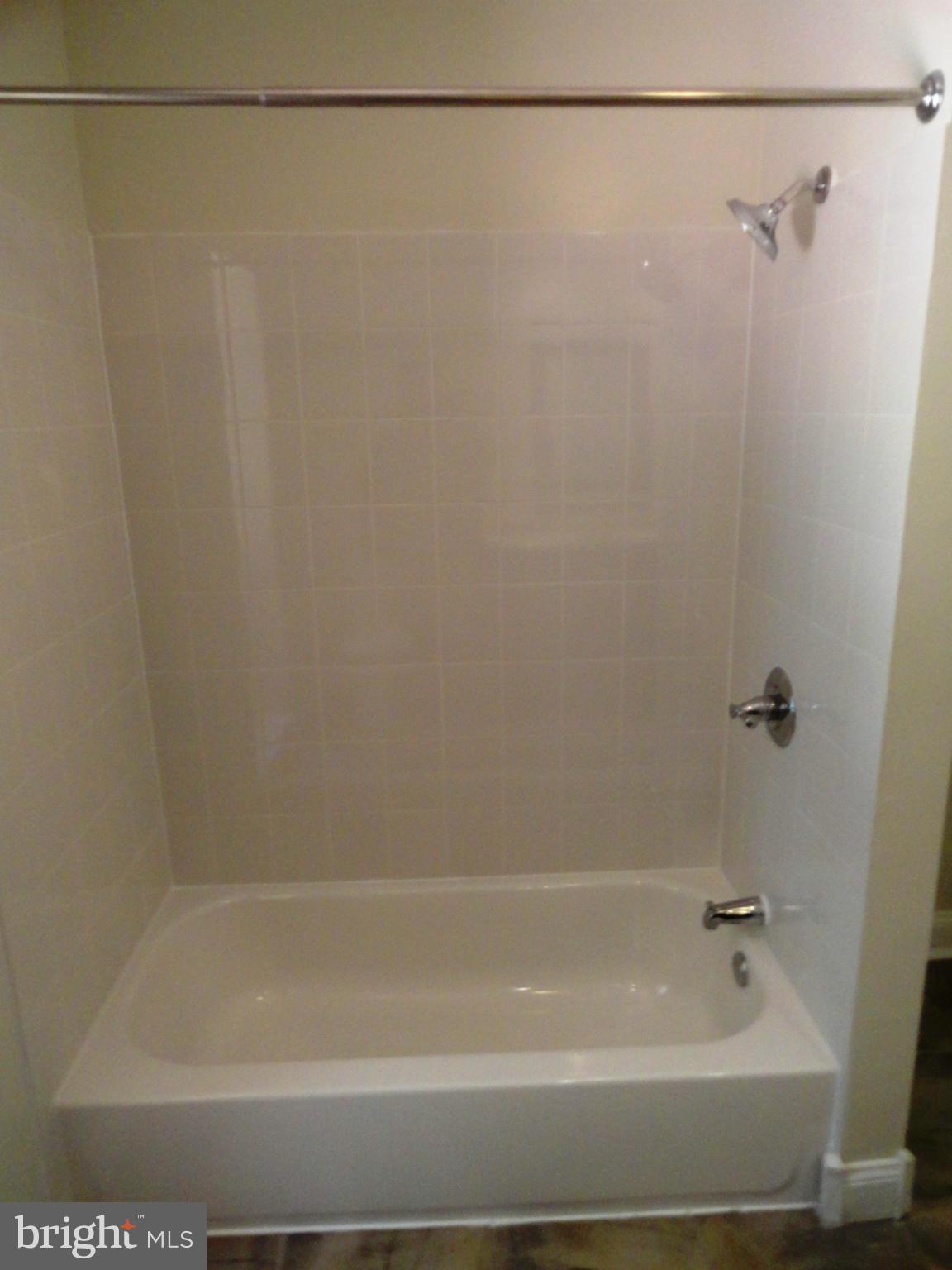 1614 Weyburn Road Baltimore, MD 21237 - Photo 16 of 25 a bathroom with a shower
