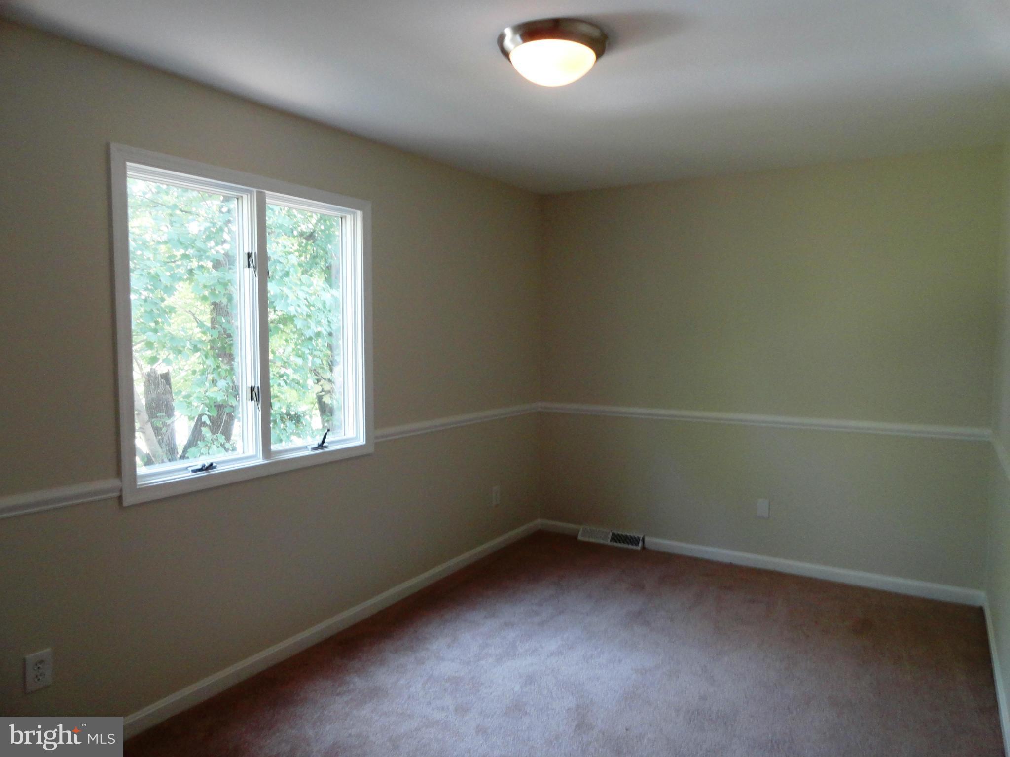 1614 Weyburn Road Baltimore, MD 21237 - Photo 17 of 25 an empty room with a window