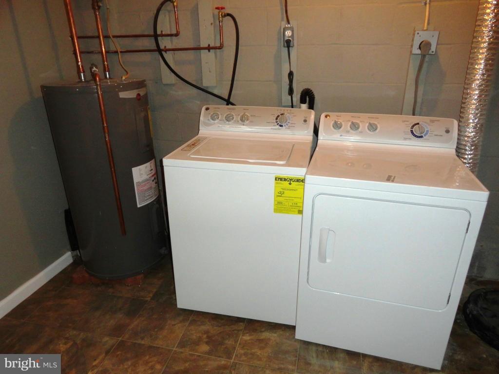 1614 Weyburn Road Baltimore, MD 21237 - Photo 23 of 25 a utility room with dryer and washer