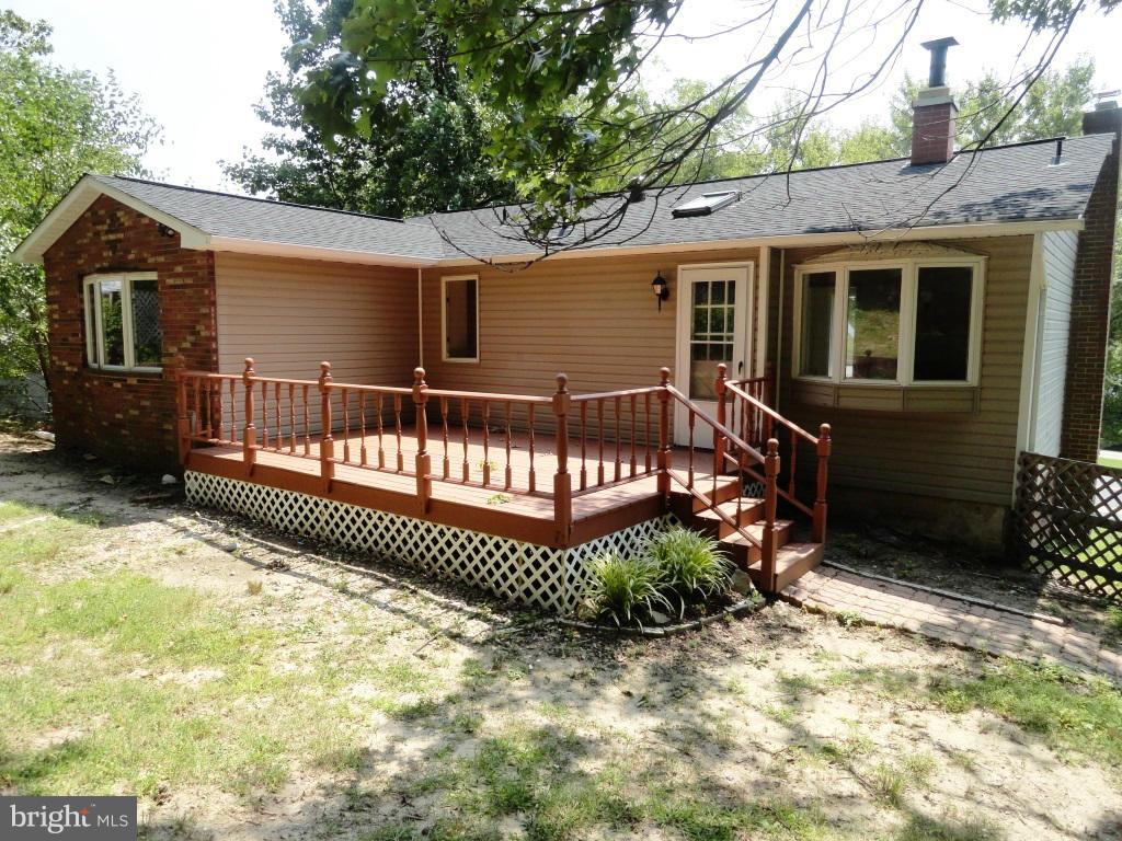 1614 Weyburn Road Baltimore, MD 21237 - Photo 24 of 25 a view of a house with wooden fence next to a yard