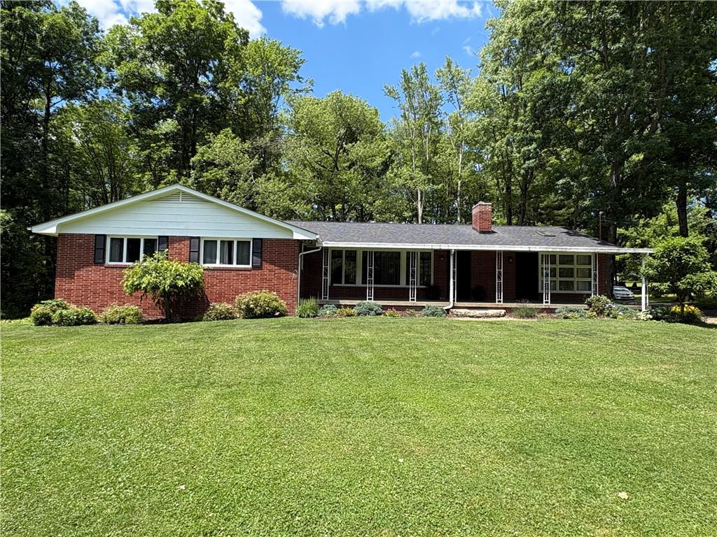 320 Cherry Hill Road Greenville, PA 16125 - Photo 4 of 38 a front view of a house with a garden