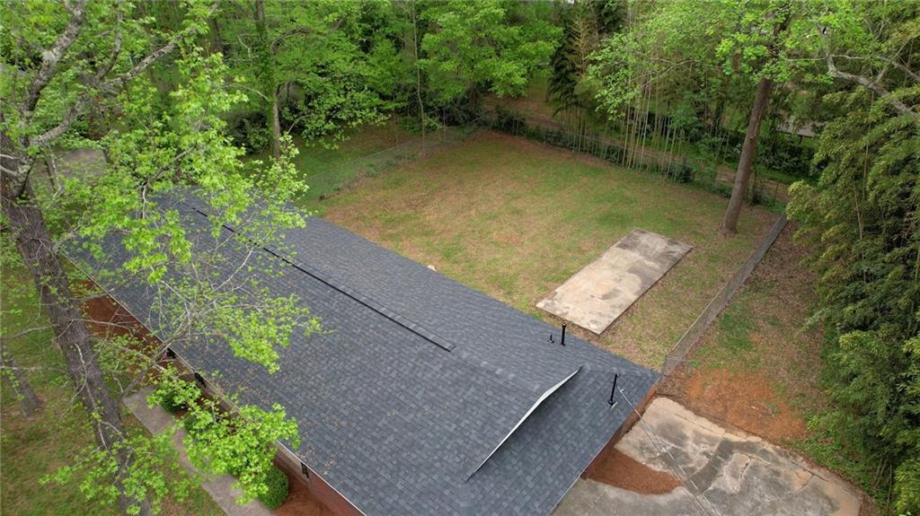 555 Joy Street Jackson, GA 30233 - Photo 2 of 56 an aerial view of a house with a yard and lake view