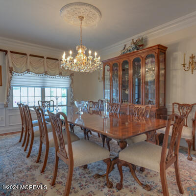 513 Mercer Avenue Spring Lake, NJ 07762 - Photo 18 of 61 a view of a dining room with furniture a chandelier and wooden floor