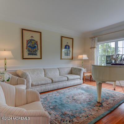 513 Mercer Avenue Spring Lake, NJ 07762 - Photo 39 of 61 a living room with furniture and a painting on the wall