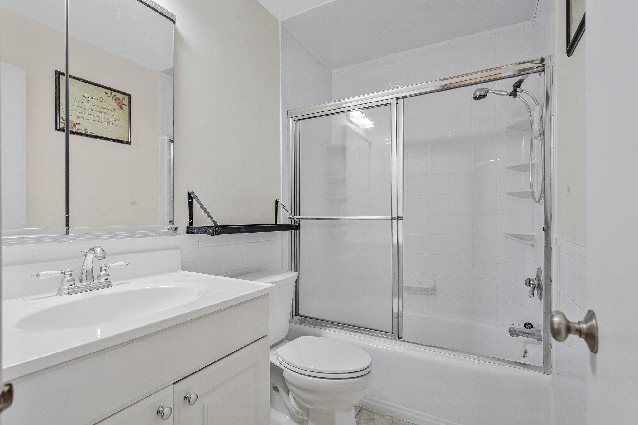 1675 Ridgely Court, Unit 182 Crofton, MD 21114 - Photo 35 of 47 a bathroom with a sink toilet and shower