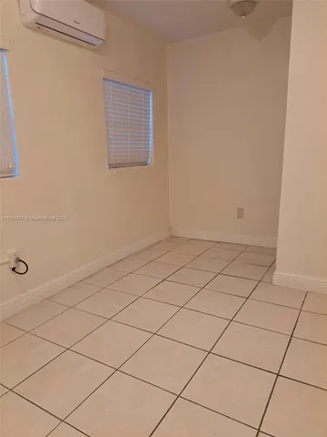 a kitchen with cabinets and appliances