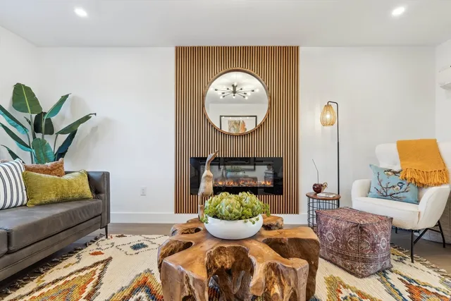 a living room with furniture and a rug