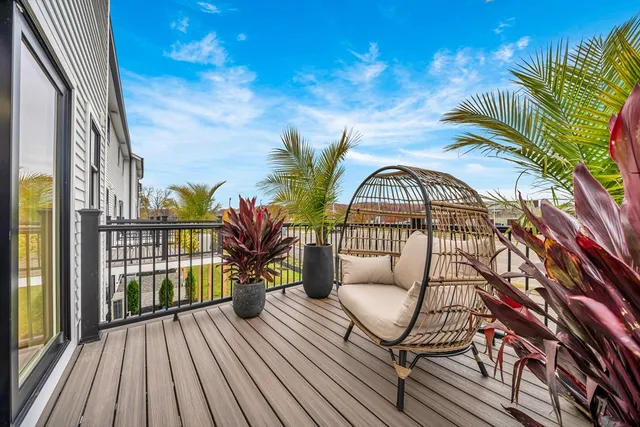a view of a balcony with wooden floor