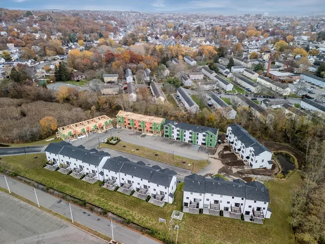 a view of a city with lawn chairs