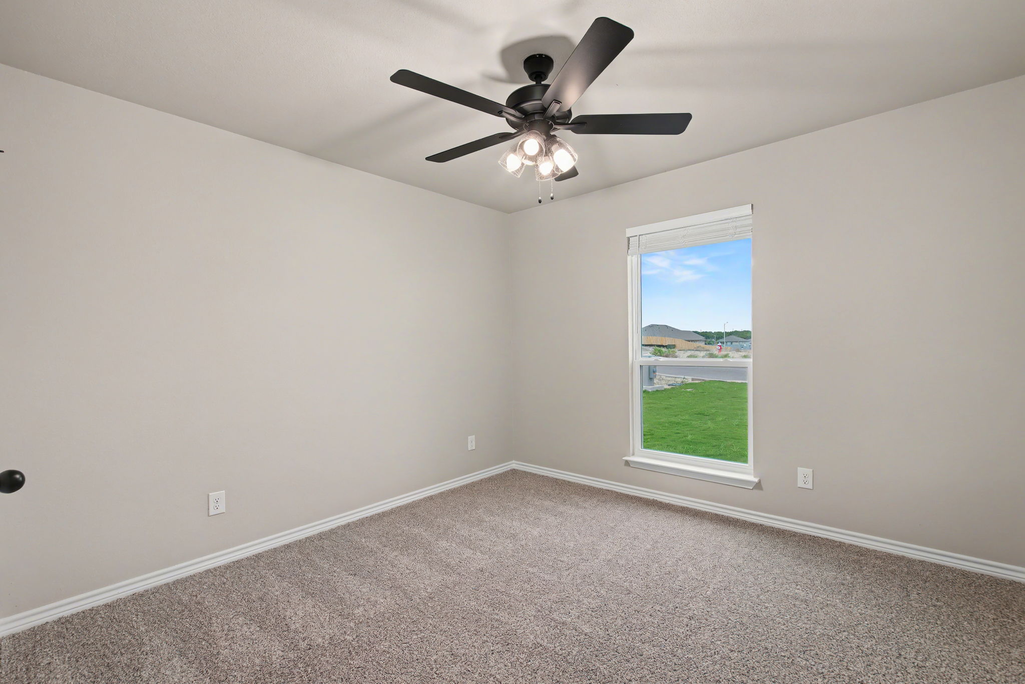 206 Water Wl Road Burnet, TX 78611 - Photo 19 of 25 Soft carpeting underfoot defines this inviting bedroom illuminated by a tall window overlooking the yard.