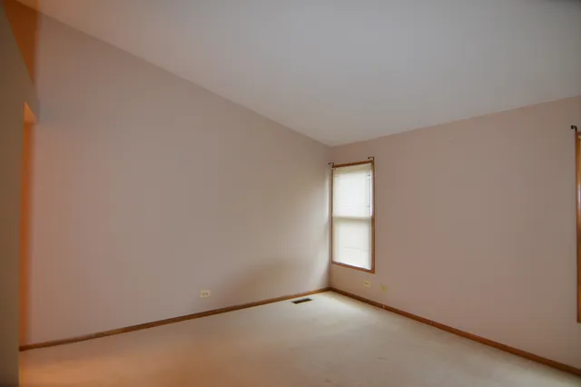 a view of an empty room and window