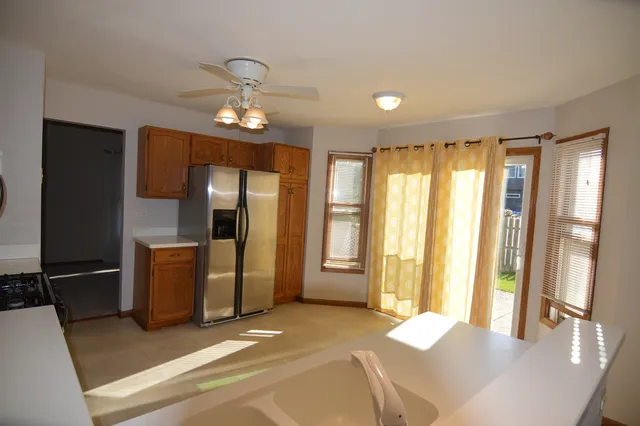 a spacious bedroom with a large bed and wooden floor