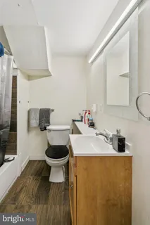 a bedroom with a bed and a tv