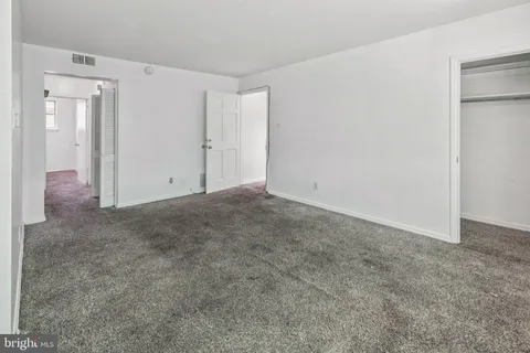 a bathroom with a bathtub and a window