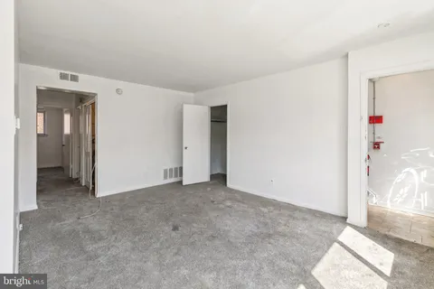 a kitchen with a stove and a window