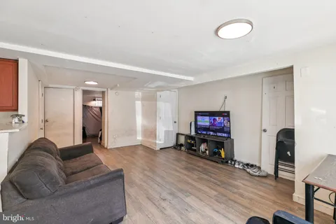 a room with furniture a rug and a window