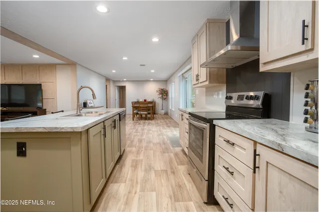 a view of a dining room with furniture and a potted plant