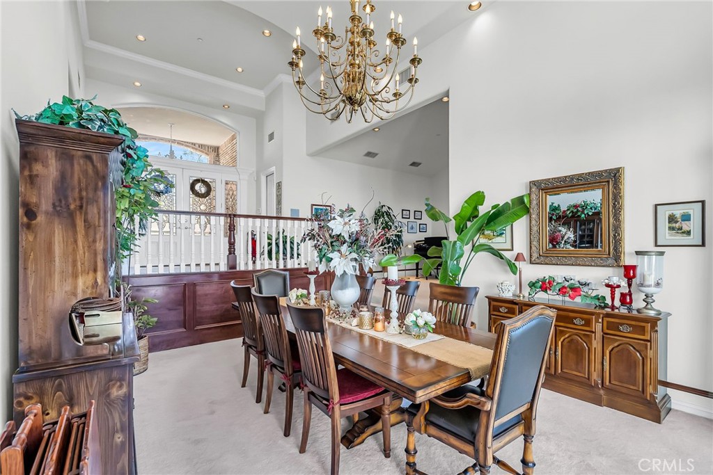 6872 Chartwell Drive Riverside, CA 92506 - Photo 11 of 51 a dining room with furniture potted plants and wooden floor