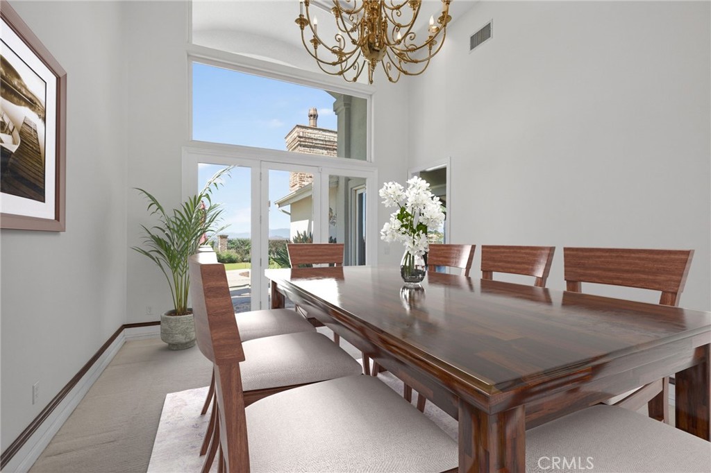 6872 Chartwell Drive Riverside, CA 92506 - Photo 11 of 75 a view of a dining room with furniture window and wooden floor