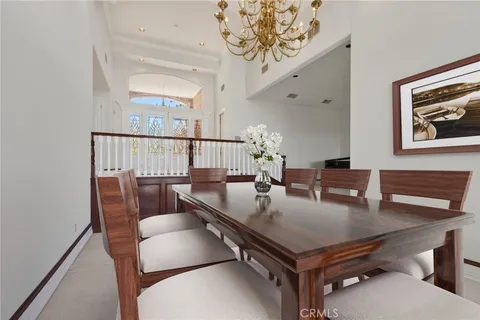 a view of a livingroom with wooden floor and a fireplace