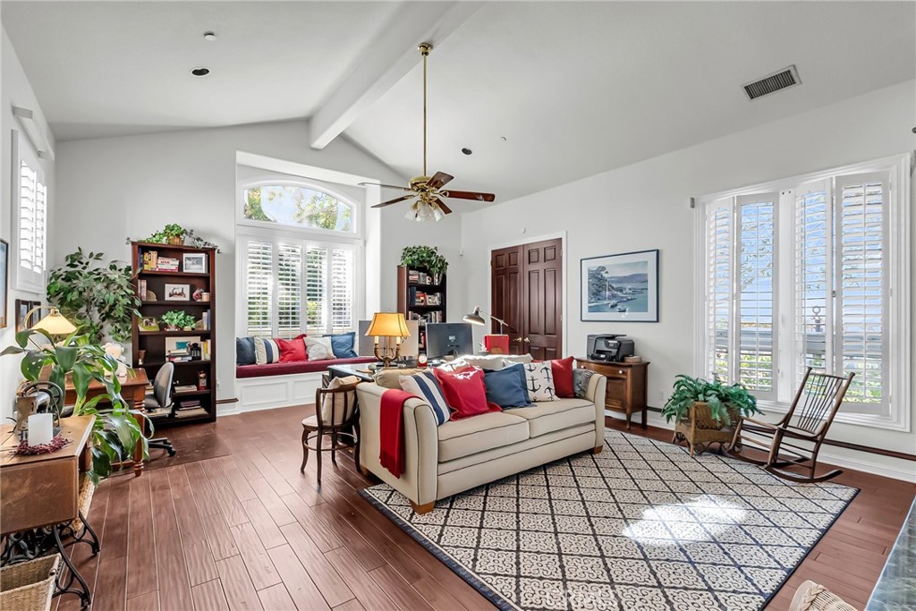6872 Chartwell Drive Riverside, CA 92506 - Photo 14 of 51 a living room with furniture and a wooden floor