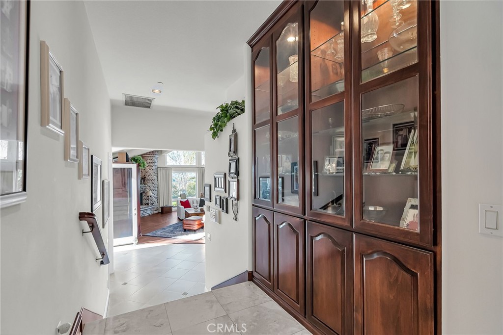 6872 Chartwell Drive Riverside, CA 92506 - Photo 16 of 51 a view of a very nice looking living room with a large tree