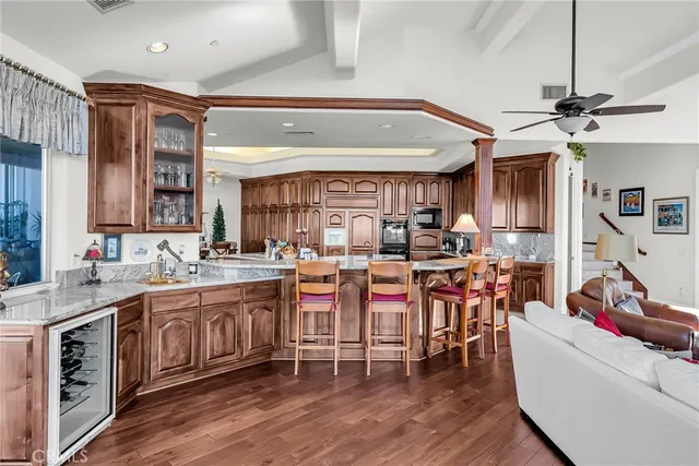 a large kitchen with lots of counter space and a sink