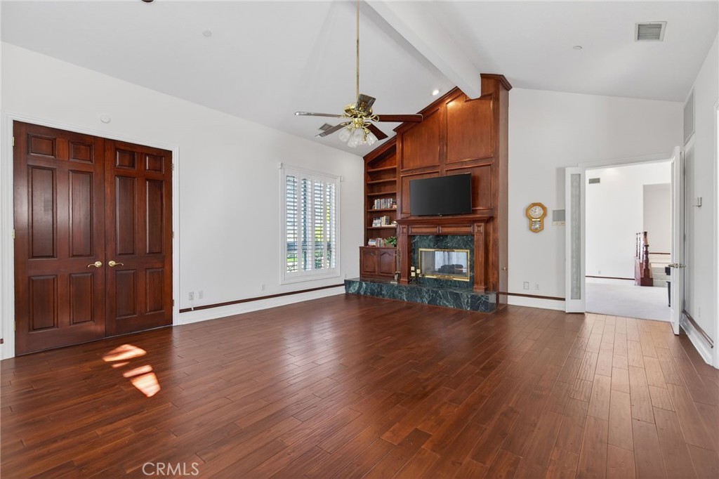 6872 Chartwell Drive Riverside, CA 92506 - Photo 20 of 75 a view of a livingroom with wooden floor and a fireplace