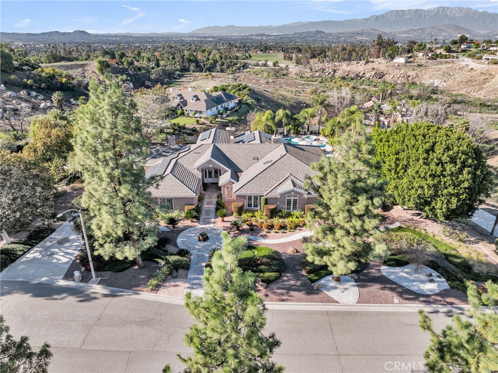 6872 Chartwell Drive Riverside, CA 92506 - Photo 2 of 51 an aerial view of a house with a yard