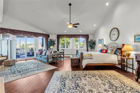 a living room with furniture two window and a table