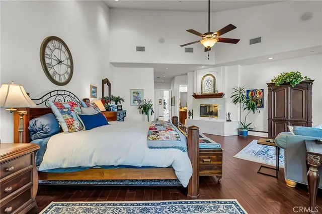 a living room with furniture a clock and a clock